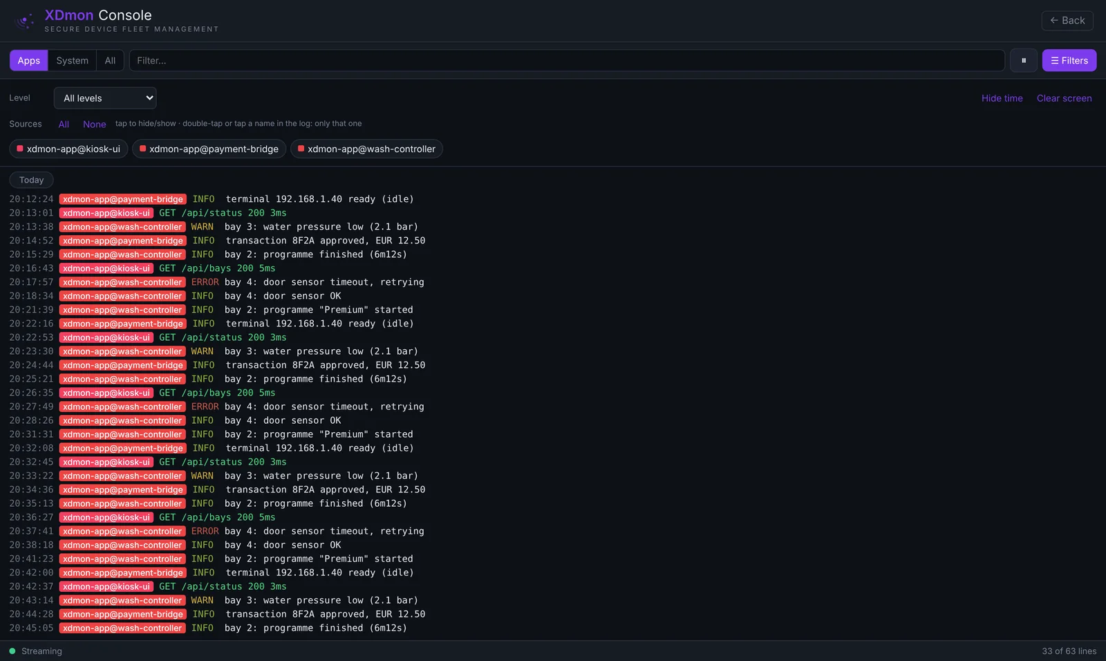 XDmon Console with app log lines from wash-controller, payment-bridge and kiosk-ui